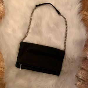 Black fold-over vegan leather clutch